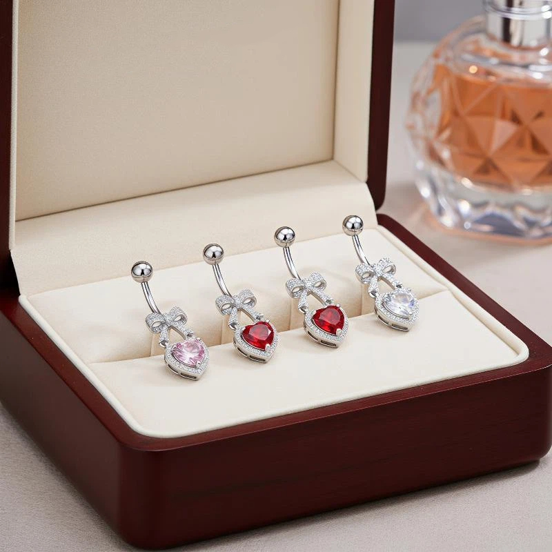 Body Jewelry Tunnels - Hypoallergene Bauchnabelringe aus Edelstahl mit CZ-Herz-Schleifen-Design